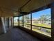 Relaxing screened patio boasting serene views of the pond and landscaping at 105 Wood Duck Cir # D, Daytona Beach, FL 32119