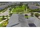 Aerial view of neighborhood park adjacent to residential rooftops at 11812 Metaphor Aly, Orlando, FL 32832