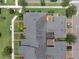 Overhead view of residential rooftops with manicured lawns and a patio at 11812 Metaphor Aly, Orlando, FL 32832