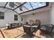 Enclosed brick patio featuring string lights and ample seating for outdoor living at 11812 Metaphor Aly, Orlando, FL 32832