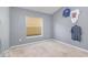 Empty bedroom with a window and neutral carpet at 1199 Stoneham Dr, Groveland, FL 34736