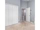 Spare bedroom with closet, carpet, and an open door at 1199 Stoneham Dr, Groveland, FL 34736
