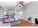 Cozy living room with hardwood floors and modern ceiling fan at 1199 Stoneham Dr, Groveland, FL 34736