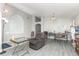 Bright living room featuring sleek flooring, arched entryways and recessed lighting at 1199 Stoneham Dr, Groveland, FL 34736