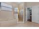 Well-lit bathroom with a glass-enclosed shower and separate soaking tub at 12207 Shadowbrook Ln, Orlando, FL 32828