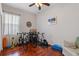 Multi-purpose room with hardwood floors, fan and currently set up with multiple bikes at 12207 Shadowbrook Ln, Orlando, FL 32828