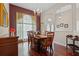 Cozy dining area with hardwood floors, chandelier, and natural light at 12207 Shadowbrook Ln, Orlando, FL 32828