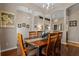 Dining room featuring decorative archways and a stylish chandelier above the wooden table at 12207 Shadowbrook Ln, Orlando, FL 32828