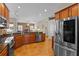 Modern kitchen boasts stainless steel appliances, granite countertops, and a functional layout for cooking at 12207 Shadowbrook Ln, Orlando, FL 32828