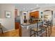 Open kitchen with breakfast bar, tiled floor, and stainless steel appliances, ideal for casual dining at 12207 Shadowbrook Ln, Orlando, FL 32828