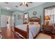 Comfortable main bedroom with hardwood floors, ceiling fan, and stylish decor at 12207 Shadowbrook Ln, Orlando, FL 32828