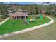 Playground with swings, slides and a covered picnic shelter providing a fun outdoor space at 12207 Shadowbrook Ln, Orlando, FL 32828