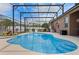 Relaxing screened-in pool area perfect for entertaining, featuring a hot tub and ample seating at 12207 Shadowbrook Ln, Orlando, FL 32828