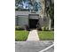 Condo with well-maintained landscaping and inviting walkway to front door at 124 Springwood Cir # B, Longwood, FL 32750