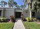 Condo with well-maintained landscaping and inviting walkway to front door at 124 Springwood Cir # B, Longwood, FL 32750