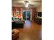Cozy living room with comfortable seating and sliding glass doors to outside at 124 Springwood Cir # B, Longwood, FL 32750