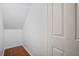 Attic featuring hardwood floors and white walls at 1300 Eastern Pecan Pl # 104, Winter Garden, FL 34787