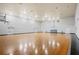 Community gymnasium with hardwood floors and basketball hoops at 1300 Eastern Pecan Pl # 104, Winter Garden, FL 34787