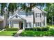 Inviting two-story townhome with lush lawn and mature trees providing shade at 1300 Eastern Pecan Pl # 104, Winter Garden, FL 34787