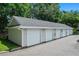 A block of garages with a grey roof at 1300 Eastern Pecan Pl # 104, Winter Garden, FL 34787