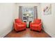 Cozy sitting area with matching chairs and natural light at 1300 Eastern Pecan Pl # 104, Winter Garden, FL 34787