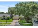 An aerial view of a well-maintained, single-story home with a lush lawn, landscaped yard, and a two-car garage at 1354 Dutch Elm Dr, Altamonte Springs, FL 32714