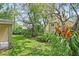 Spacious backyard showcasing lush landscaping, mature trees, creating a tranquil and inviting outdoor space at 1354 Dutch Elm Dr, Altamonte Springs, FL 32714