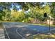 Well-maintained basketball court surrounded by trees, providing recreational opportunities for residents at 1354 Dutch Elm Dr, Altamonte Springs, FL 32714