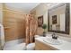 Full bathroom with a floral-themed shower curtain and elegant fixtures at 1354 Dutch Elm Dr, Altamonte Springs, FL 32714