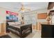 Bedroom with a dark wood bed frame, ceiling fan and tan decor at 1354 Dutch Elm Dr, Altamonte Springs, FL 32714