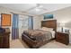 Comfortable bedroom featuring a sizable wood bed frame and bright window at 1354 Dutch Elm Dr, Altamonte Springs, FL 32714