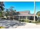 Community clubhouse, with covered porch, landscaping, and mature trees, perfect for community gatherings at 1354 Dutch Elm Dr, Altamonte Springs, FL 32714