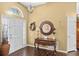 Spacious foyer featuring wood floors, a decorative mirror, and a chandelier at 1354 Dutch Elm Dr, Altamonte Springs, FL 32714