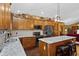Spacious kitchen featuring granite countertops, ample wood cabinetry, and stainless steel appliances at 1354 Dutch Elm Dr, Altamonte Springs, FL 32714