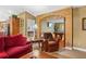 Open-concept living room with decorative archway offering seamless transition to the game room at 1354 Dutch Elm Dr, Altamonte Springs, FL 32714