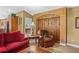 Cozy living room featuring archway with barn doors leading to a bedroom, blending style and functionality at 1354 Dutch Elm Dr, Altamonte Springs, FL 32714