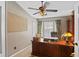 Well-lit office featuring a large wooden desk and dark brown leather office chair at 1354 Dutch Elm Dr, Altamonte Springs, FL 32714