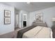 Serene bedroom featuring neutral decor, a dresser, and an ensuite bathroom for added convenience at 1397 Dalkeith Cv, Sanford, FL 32771