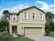 Charming two-story home with neutral siding, attached two-car garage, and well-maintained landscaping at 1397 Dalkeith Cv, Sanford, FL 32771
