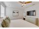 Comfortable bedroom featuring a dresser with a TV at 1421 Wexford Way, Davenport, FL 33896