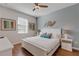 Serene bedroom featuring a plush bed, neutral tones, and decorative wall art at 1421 Wexford Way, Davenport, FL 33896