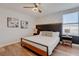 Comfortable bedroom with stylish ceiling fan, decorative headboard, and neutral color scheme at 1421 Wexford Way, Davenport, FL 33896