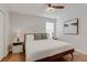 Well-lit bedroom with natural light, modern decor, and hardwood floors at 1421 Wexford Way, Davenport, FL 33896