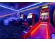 Inviting game room featuring several arcade style games and colorful decor at 1421 Wexford Way, Davenport, FL 33896
