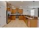 This kitchen features stainless steel appliances, lots of cabinets, and a breakfast bar at 1421 Wexford Way, Davenport, FL 33896
