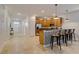 The home features an open kitchen design and breakfast bar for additional seating at 1421 Wexford Way, Davenport, FL 33896