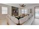 Inviting living room with comfortable sectional and a view of the outdoor pool area at 1421 Wexford Way, Davenport, FL 33896
