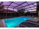 Relaxing poolside view of a private pool with a spa and comfortable lounge seating at 1421 Wexford Way, Davenport, FL 33896