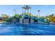 Fun splash pad area with water features, slides, and a colorful, playful design for  at 1421 Wexford Way, Davenport, FL 33896
