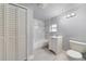 Bathroom with updated vanity, shower-tub combo and tiled walls with design accents at 147 Country Club Dr, Sanford, FL 32771